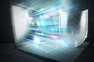 laptop emitting glowing digital light beams-what is disaster recovery plan​