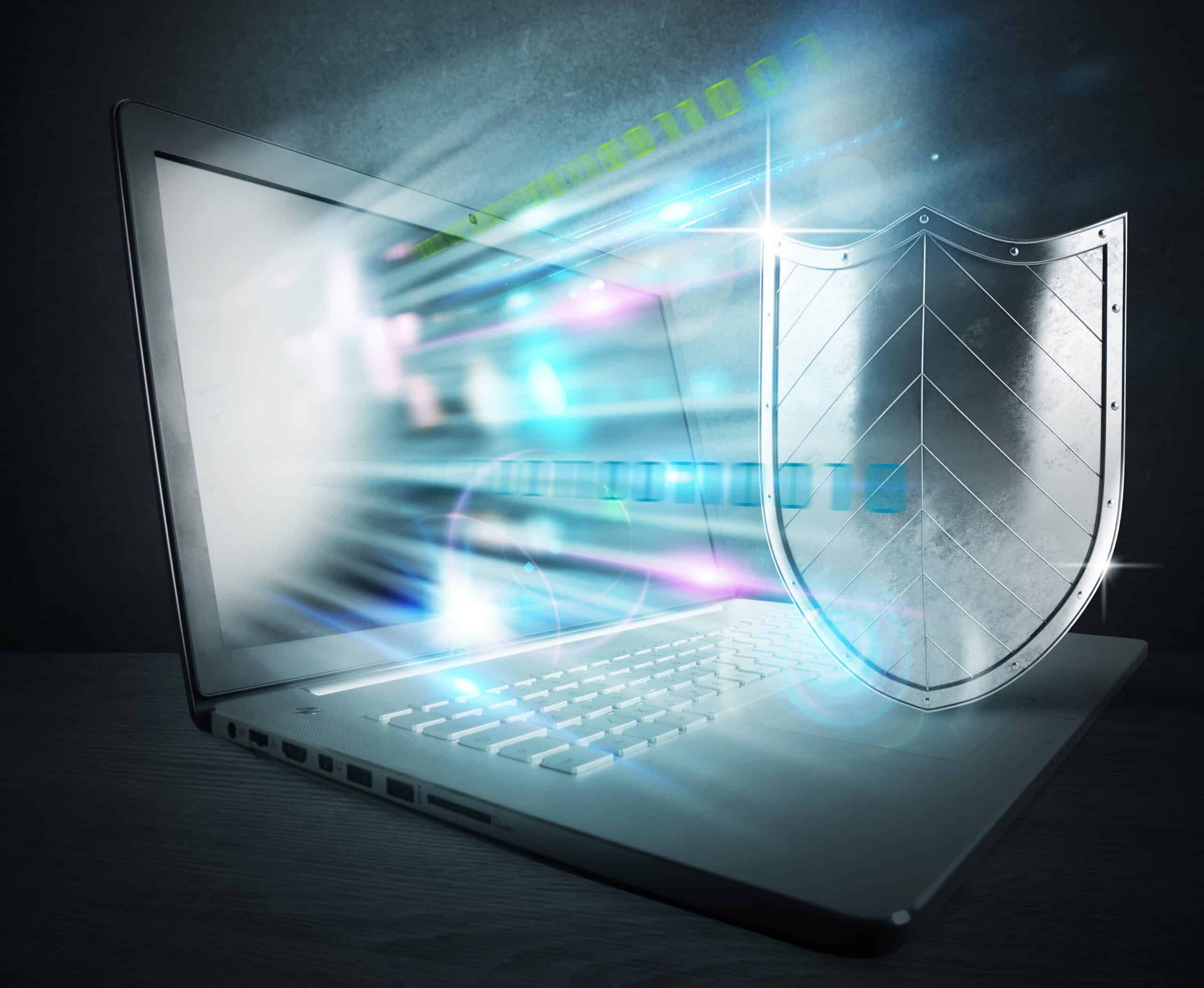 laptop emitting glowing digital light beams-what is disaster recovery plan​