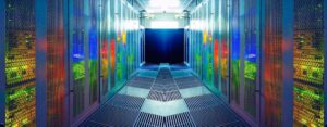 A brightly lit, futuristic data center with rows of server racks reflecting colorful lights-business continuity plan