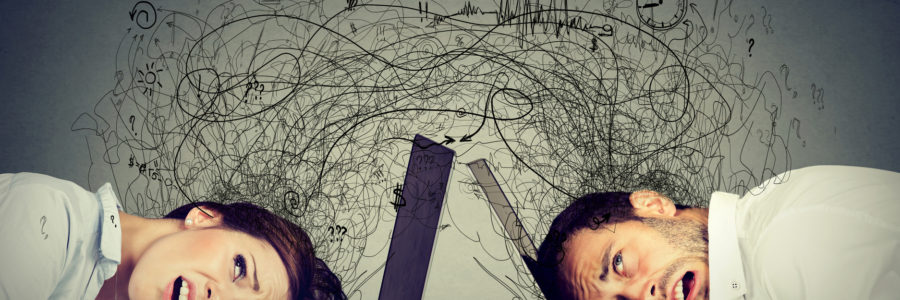 Frustrated business professionals with heads on laptops-business Intelligence software