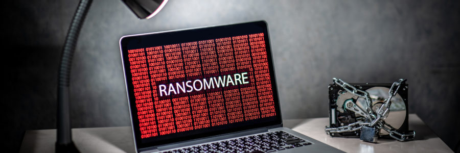 Hard disk file locked by chain and padlock with laptop computer - ransomware prevention​