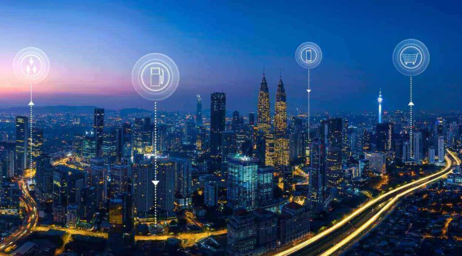 Smart city at night with interconnected digital icons-what is iot​